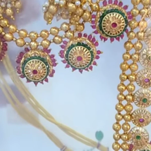 Royal 1-Gram Gold Plated Kemp Ruby & Emerald Bridal Combo Set with Long Haram, Choker & Jhumkas - Macro Detail Craftsmanship Focus